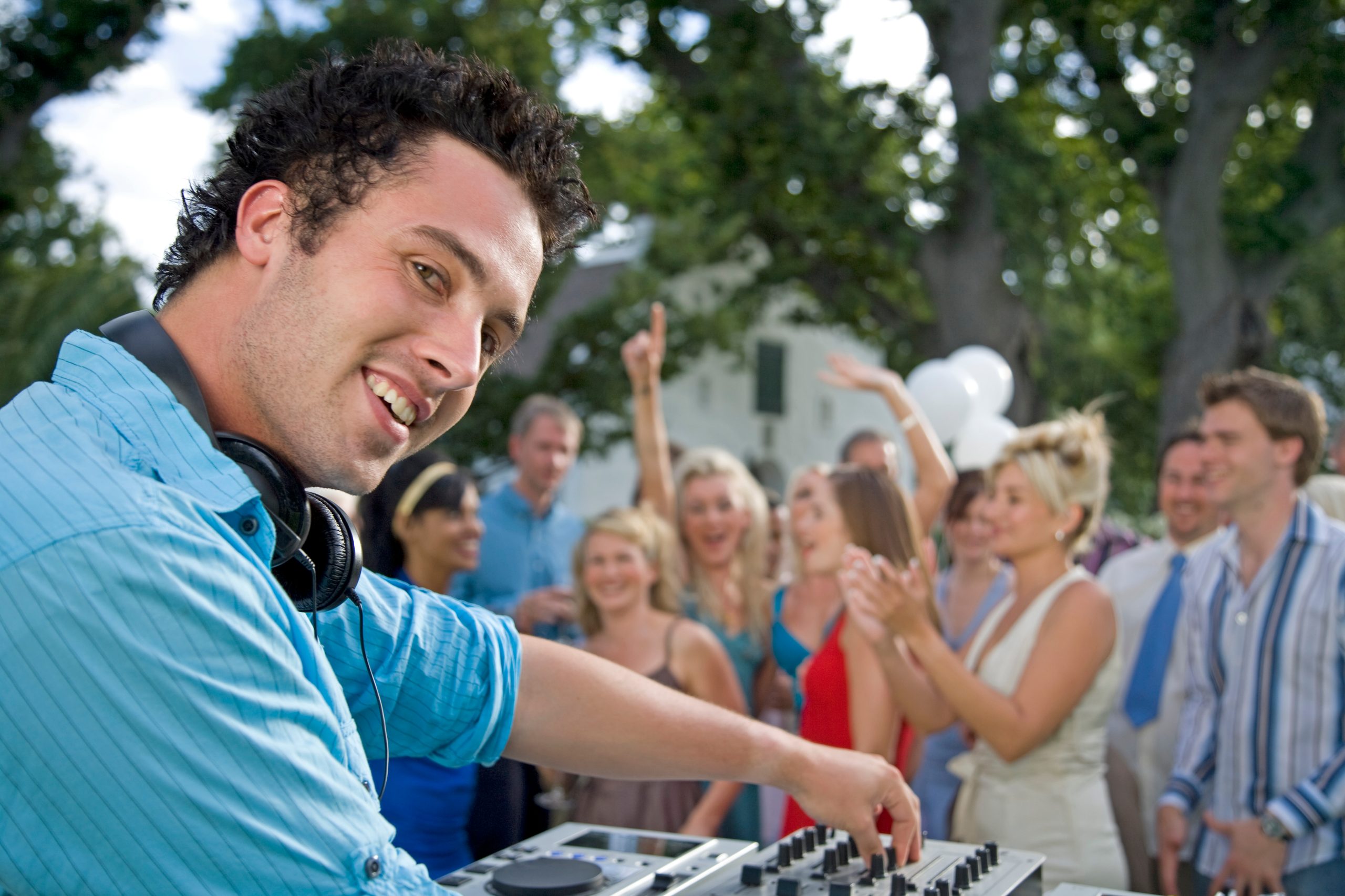 a-man-djing-at-a-summer-garden-party-2026-01-11-09-44-05-utc